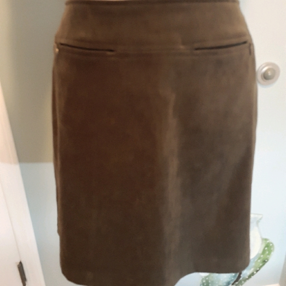 Green mini skirts with front pockets.